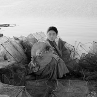 A fisherwoman by the sea